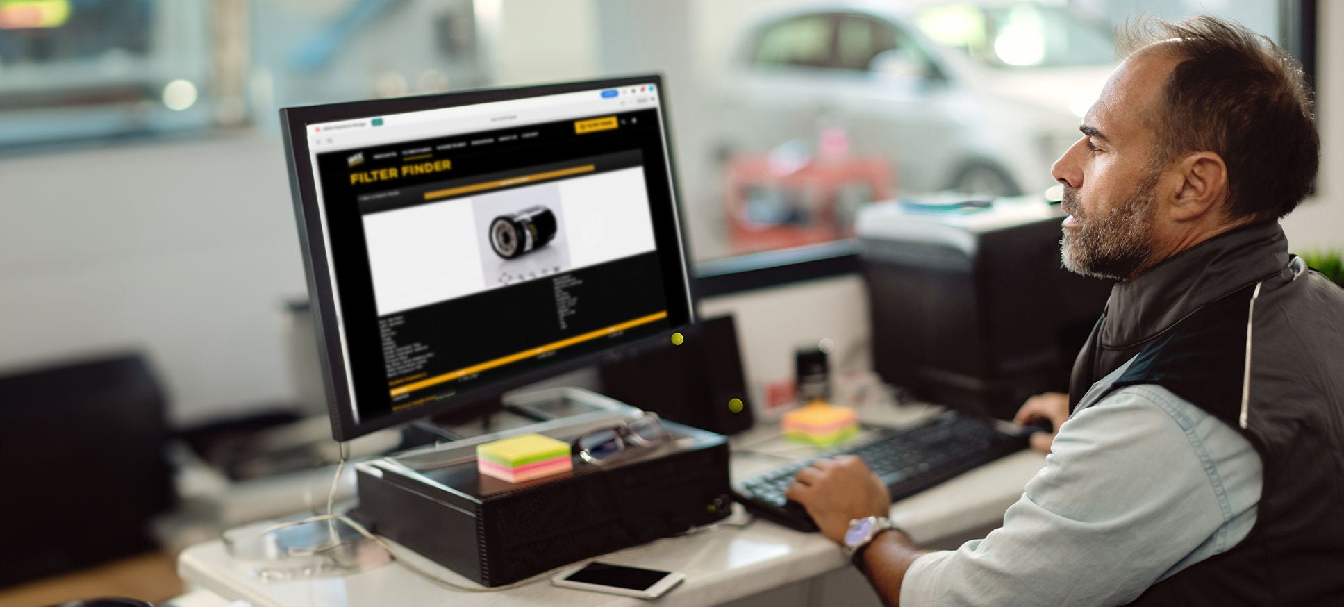 Retail counterperson searching online for a WIX part