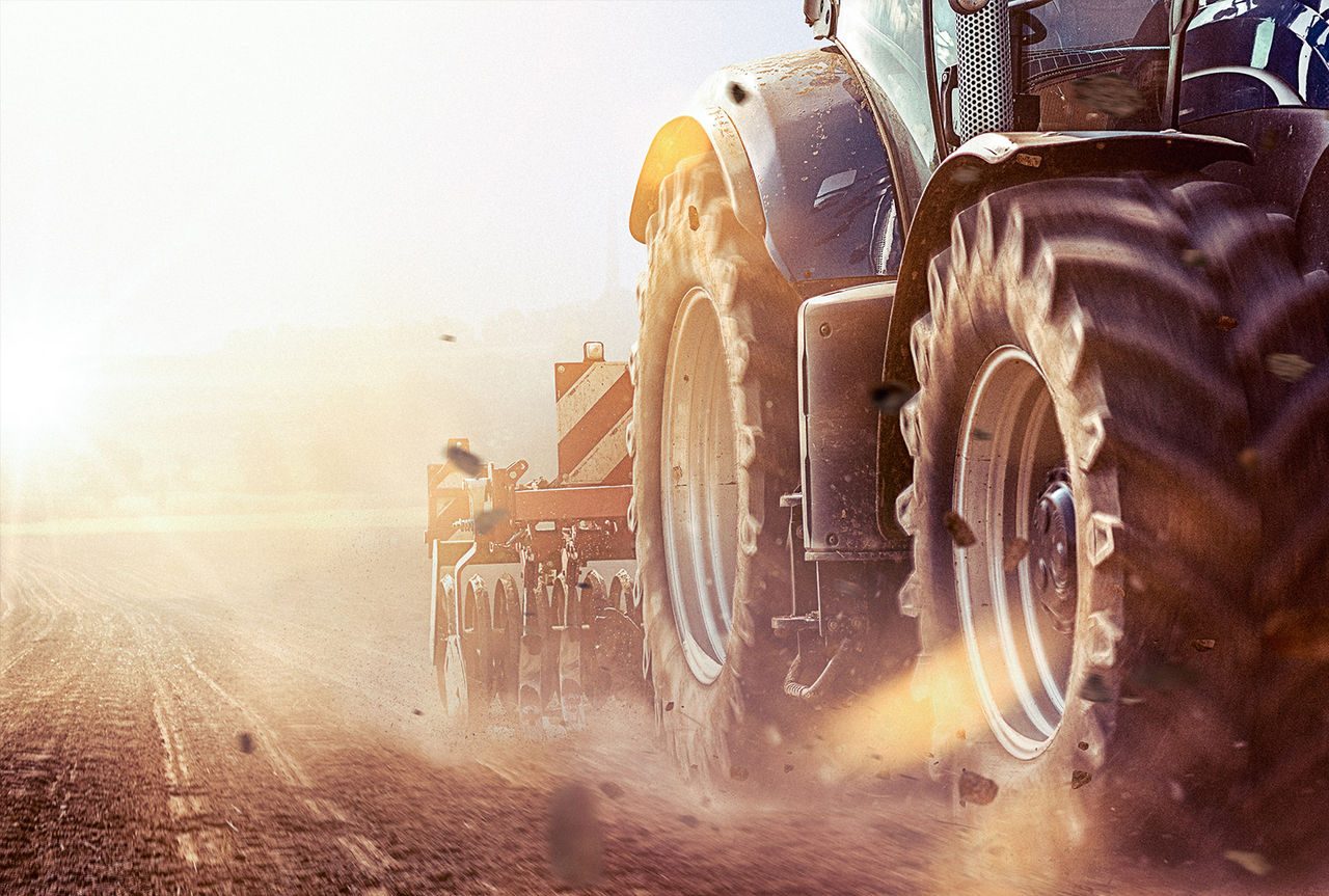 Tractor tilling a field